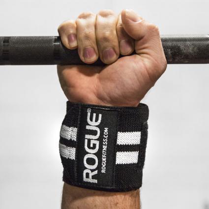 Man gripping bar to showcase Rogue Wrist Wraps - White Series in Black with White Stripes