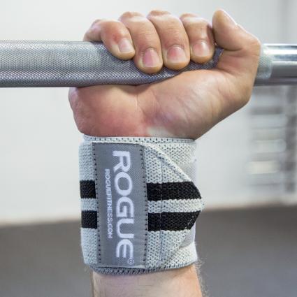 Man gripping bar to showcase Rogue Wrist Wraps - White Series in Grey with Black Stripes